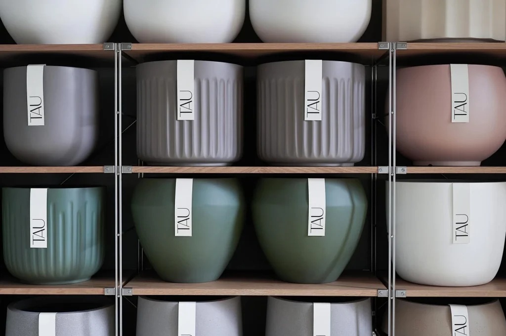 TAU planters on showroom shelving